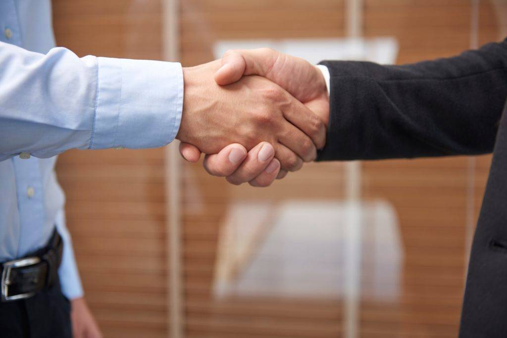 Handshake after signing an important contract